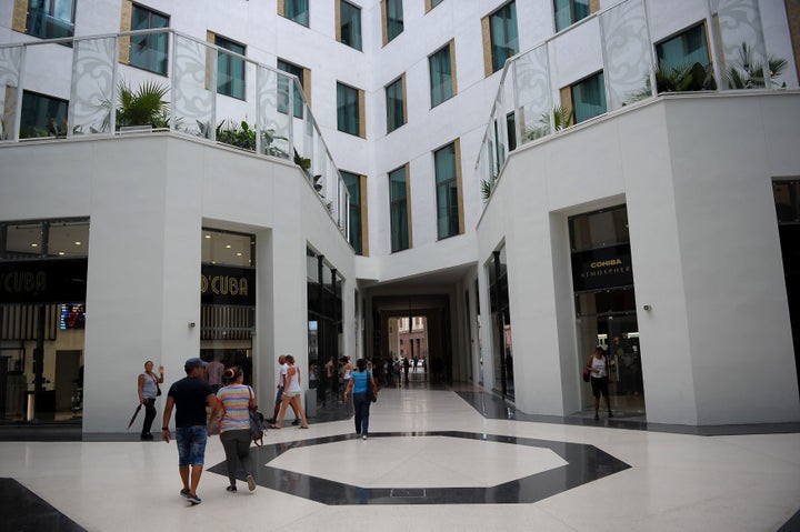 Cubans visit the shops in the Gran Hotel Manzana. 