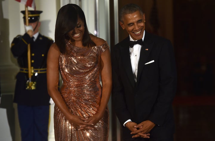 US President Barack Obama and First Lady Michelle Obama wait for the arrival of Italian Prime Minister Matteo Renzi and his wife Agnese Landini on the North Portico of the White House before a state dinner in Washington, DC on October 18 2016.