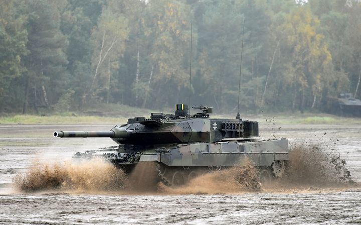 A German Leopard 2 tank crosses a river during a training exercise in Munster, Germany, October 9, 2015.