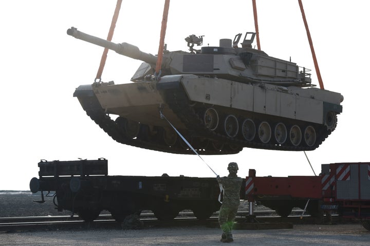 A U.S. soldier helps to maneuver a tank from a railway car at the Mihail Kogalniceanu Air Base in Romania on February 14, 2017.