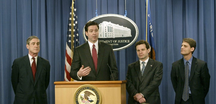 Wray, third from left, listens as James Comey speaks at a 2004 press conference. Robert Mueller (far left), then head of the FBI, has been appointed special counsel in an investigation into alleged collusion between President Donald Trump and Russian officials.