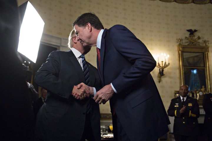 President Donald Trump, left, warmly greets then-FBI Director James Comey in January. Comey claims Trump pressured him over the investigation into Russia's election interference.