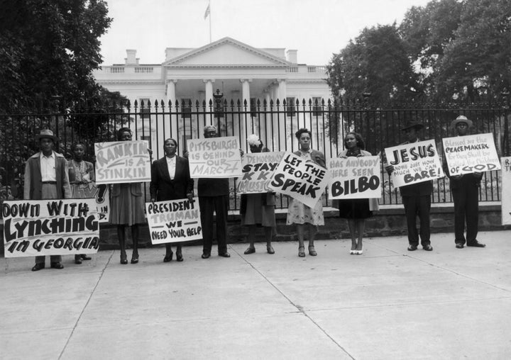 People demonstrate outside the White House against the lynching of black people in 1946.