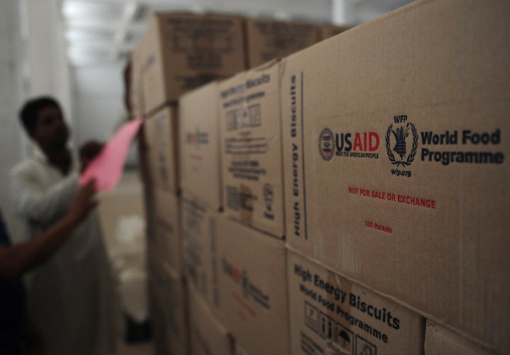 A Pakistani worker arranges aid supplies at a supply centre in the Jacobabad district in 2012. The president's spending plan eliminates funding for key U.S. foreign food aid programs.