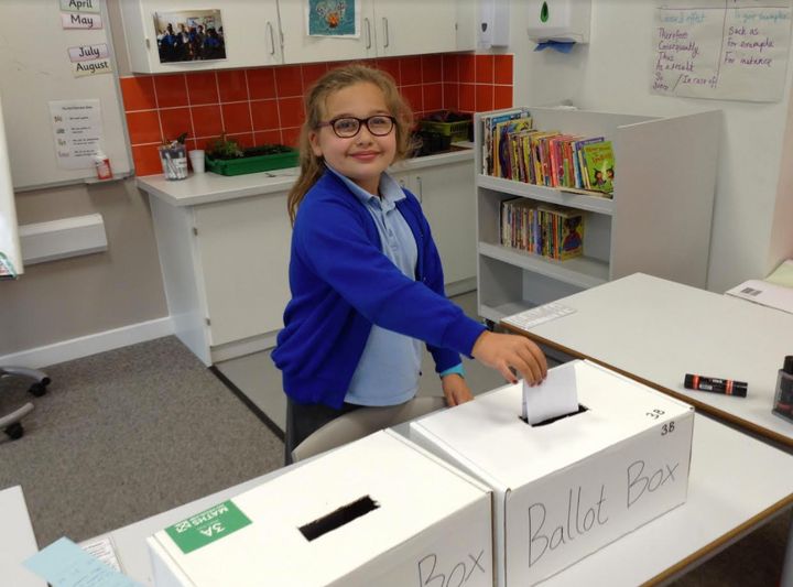Children voted by putting their choice in the handmade ballot boxes.