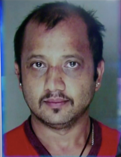 Yuba Sharma in a booking photo.