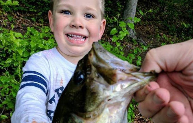<p>Sam, 3, with a fish that’s not the first one he ever caught himself</p>