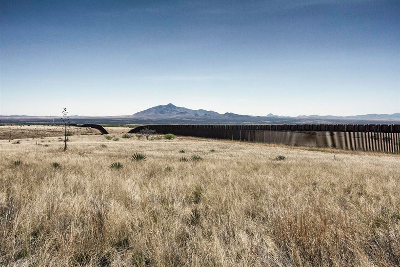 Border Patrol agents driving patrol on the fence line at edge of the Coronado National Memorial.