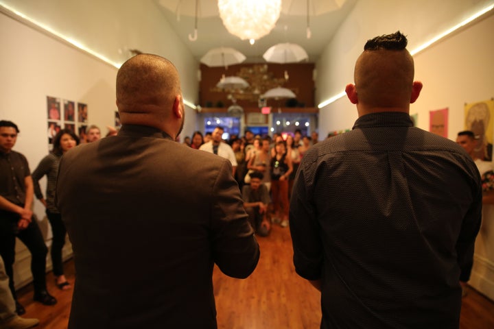 <p><em>Artists Julio Salgado and Chucha Marquez addressing show attendees during the May 20 opening of Que Siga La Fiesta in Oakland, CA. </em></p>