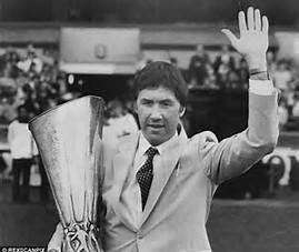 Manager Keith Burkinshaw at his last Spurs match proudly holds UEFA Cup while waving goodbye