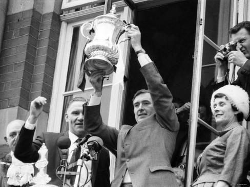 Manager Billy Nick and his captain Danny Blanchflower hoist FA Cup