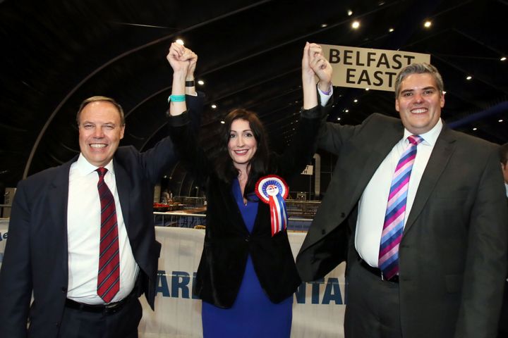 Democratic Unionist Party leader Nigel Dodds (left) celebrates.