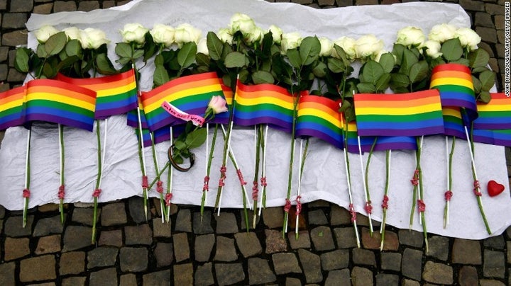 <p>49 white roses and rainbow flags for the lives lost in the Orlando Pulse attack. </p>