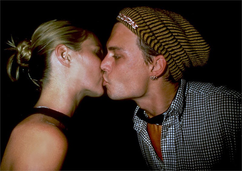 Kate Moss schmooches with Johnny Depp.