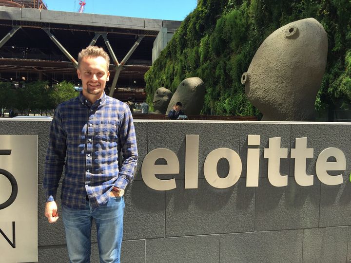 Kirill stands in front of the Deloitte office in San Francisco, where he worked after graduating from UC Berkeley.