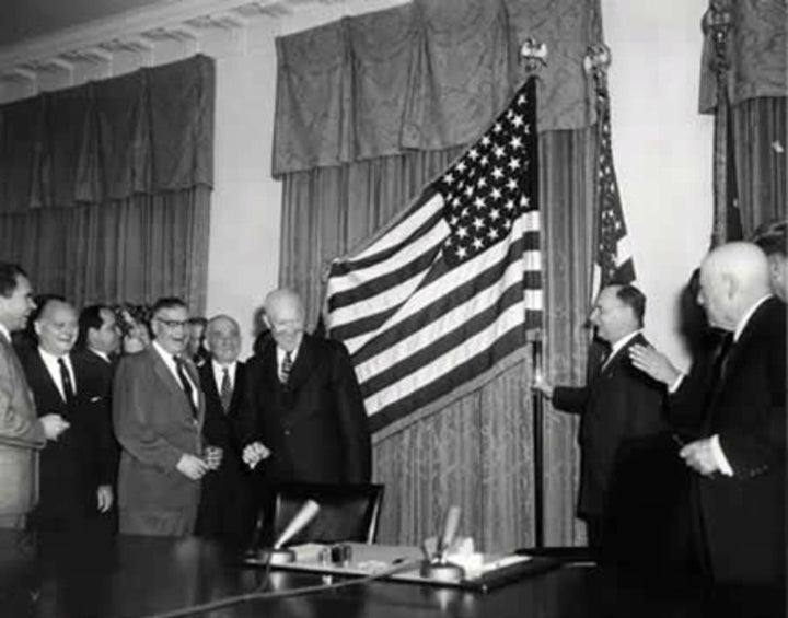 President Dwight Eisenhower at the unfurling of the 49-star flag on Jan. 3, 1959, the day Alaska became a state. Ike would have to repeat the ritual eight months later when Hawaii joined the Union.