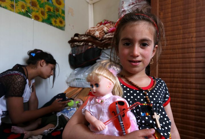 Christena, a 6-year-old Iraqi Christian girl, holds a doll during a meeting with her family at a camp for displaced Christians in Arbil, northern Iraq, on Saturday.
