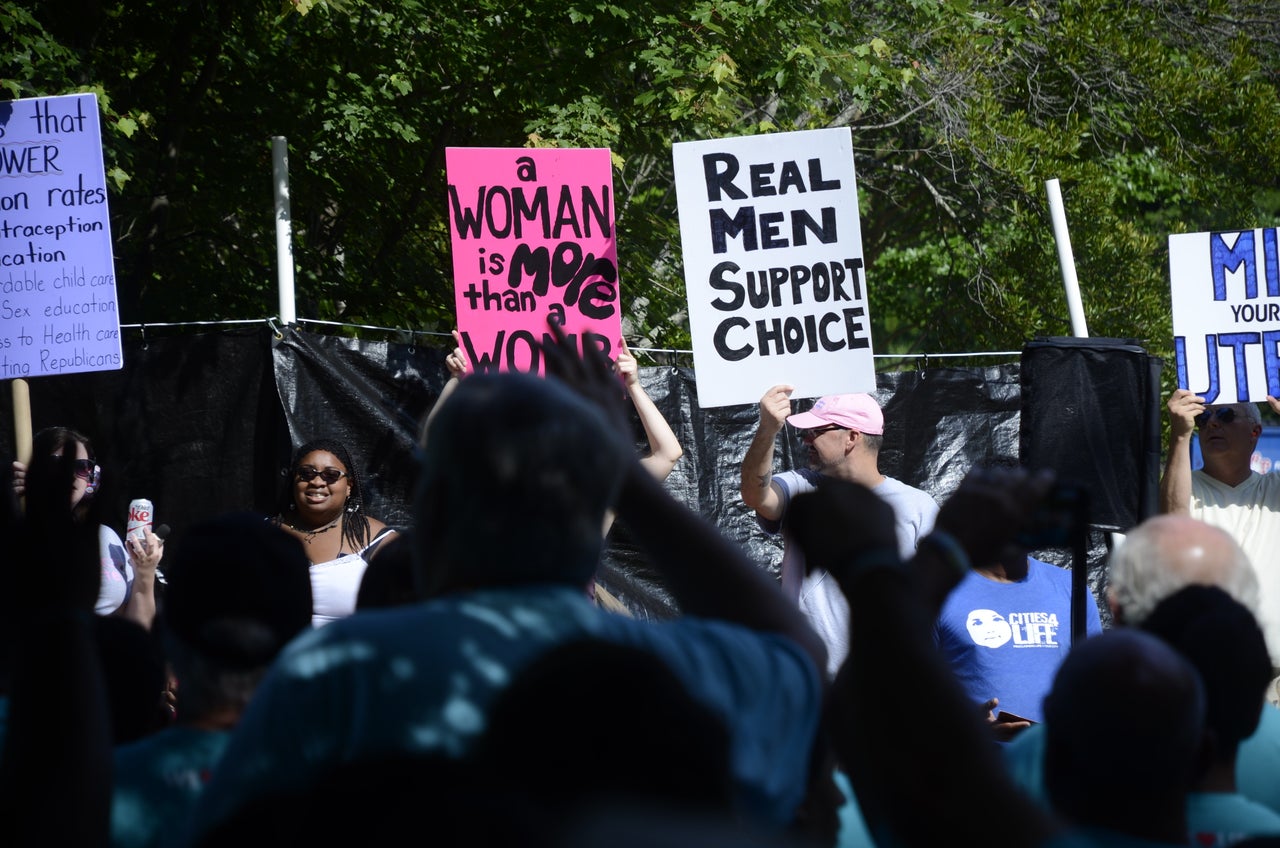 APWHC volunteer Jasmine Sherman, left, squares off with LLC protesters on Saturday.