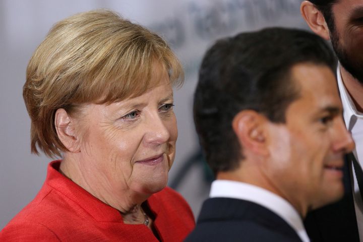 German Chancellor Angela Merkel and Mexico President Enrique Pena Nieto participate in an event with Mexican and German business leaders in Mexico City on Saturday.