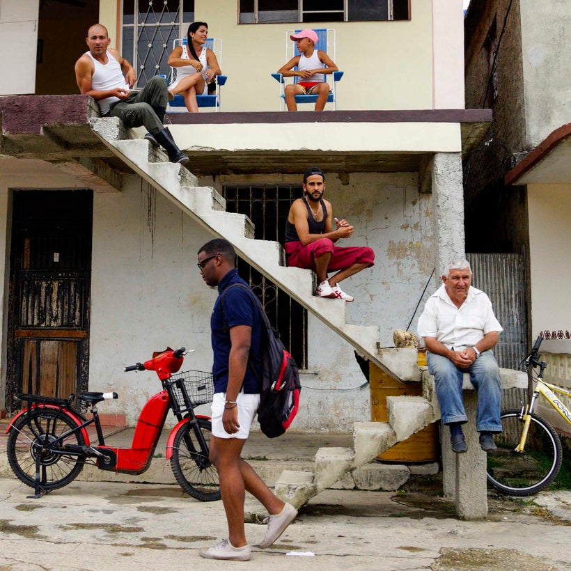 These people were genuinely just hanging out on the stoop like this, but I waited for the man to walk by to get the best comp