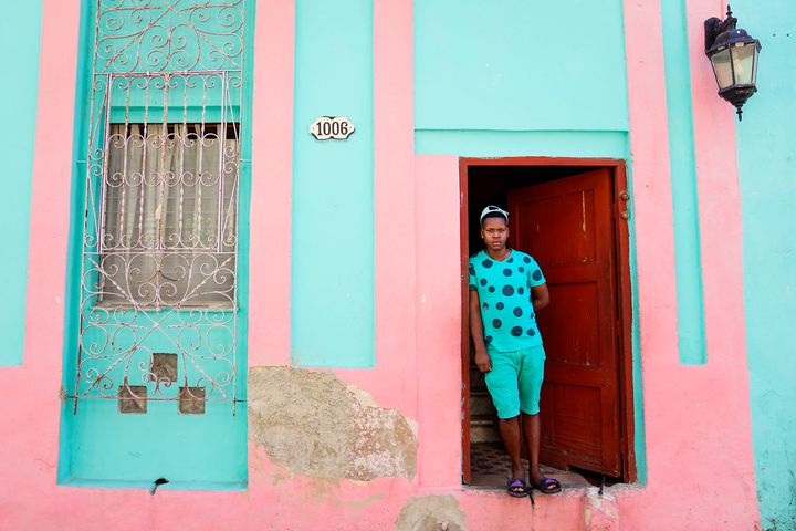 I saw this boy exit this doorway and couldn’t believe the color synchronicity so I asked him to pose for me.