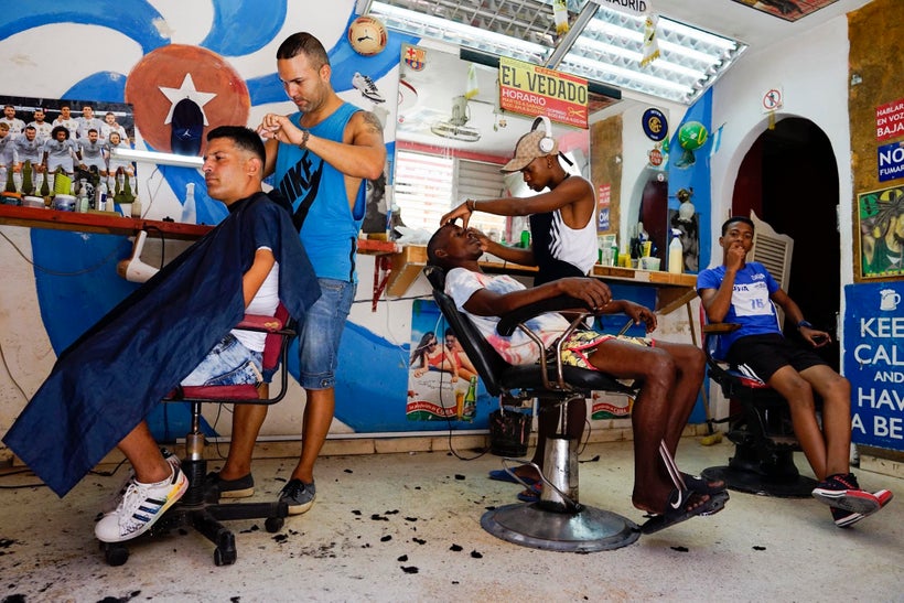 I walked past this salon and decided to just walk in and ask if I could take some photos. The guy on the right jumped in the