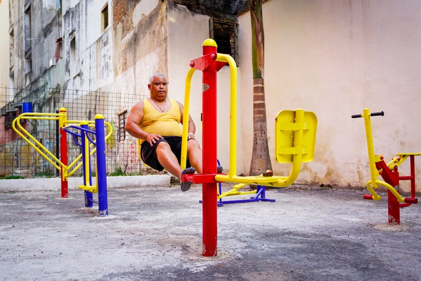 I wandered into a gated area into this colorful gym and followed this man around for several minutes, capturing him working o