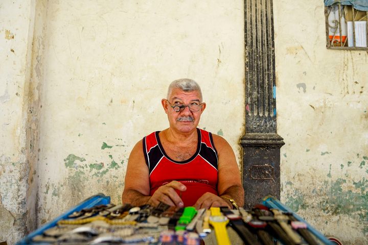 I walked up to this man and started asking him about the watches he was repairing. We quickly made friends and then he let me take all sorts of photos of him from all different angles. I liked his facial expression here best.