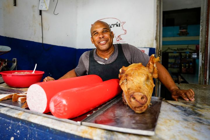 My friend and I hung out with this guy taking photos of him for at least 5 minutes as he made a sale to a little old lady. He was very excited that we were showing so much interest in his pig.