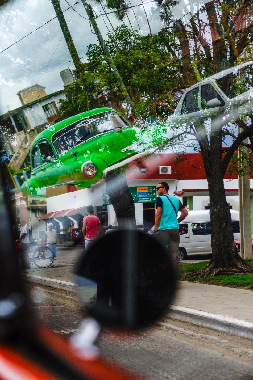 I shot this from the backseat of a taxi, as I noticed all the reflections going on in the window, and took several, patiently