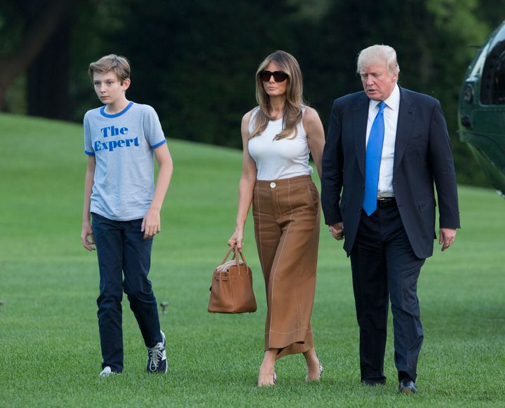 President Donald Trump, first lady Melania Trump and their son Barron Trump are seen arriving at the White House on Sunday.