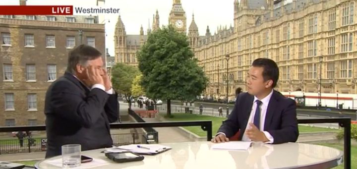 BBC presenter Simon McCoy holds his hands to his head after Tory MP Alan Mak claims the party is 'strong and stable'.