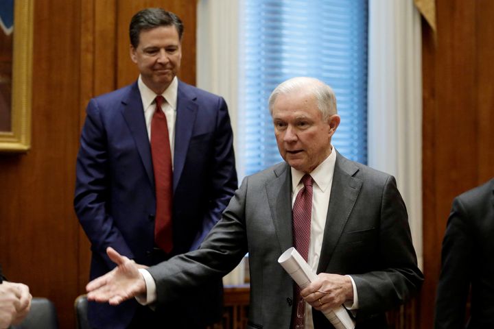 Attorney General Jeff Sessions gestures as then-FBI Director James Comey looks on at the Justice Department on Feb. 9, 2017.