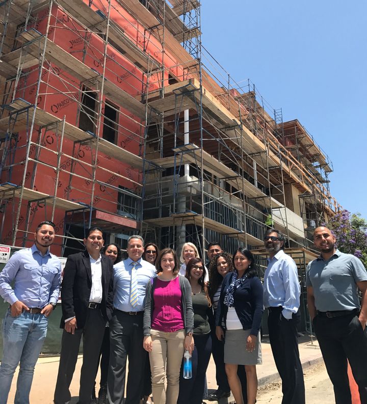 Cielito Lindo is an affordable housing community developed by East L.A. Community Corp. Antonio Ramon (pictured, in tie, with the real estate team), just completed the HDTI training that helped him manage the project.