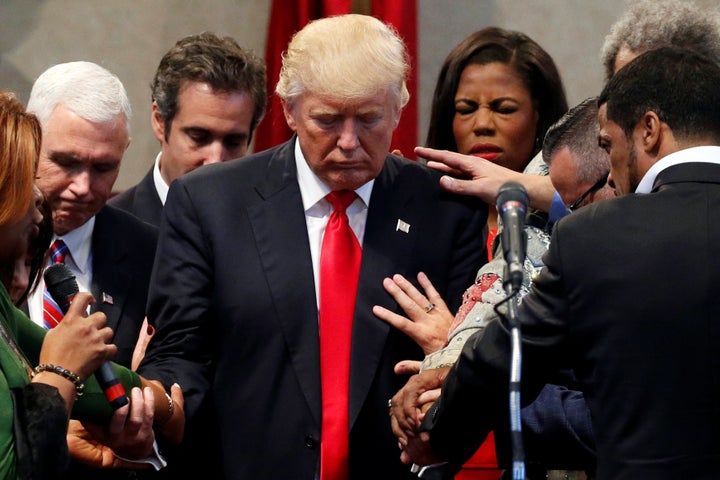 Members of the clergy pray over Donald Trump, then the Republican presidential nominee, on Sept. 21, 2016, at the New Spirit Revival Center in Cleveland Heights, Ohio.