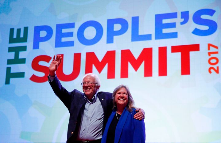 Sen. Bernie Sanders (I-Vt.) waves to the crowd alongside his wife Jane after his speech at The People's Summit in Chicago on Saturday.