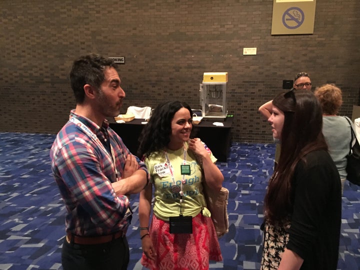 Dan Gordon, left, talks with with fellow California activists Marcia Martin, center, and Melissa Demyan after Bernie Sanders' speech at the People's Summit on Saturday.