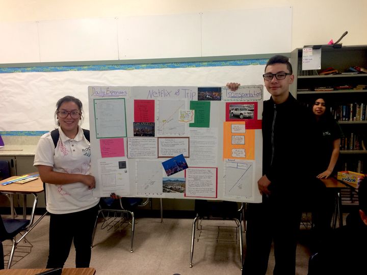 Eighth grade math students at Roots International Academy in Oakland show off an algebra project 