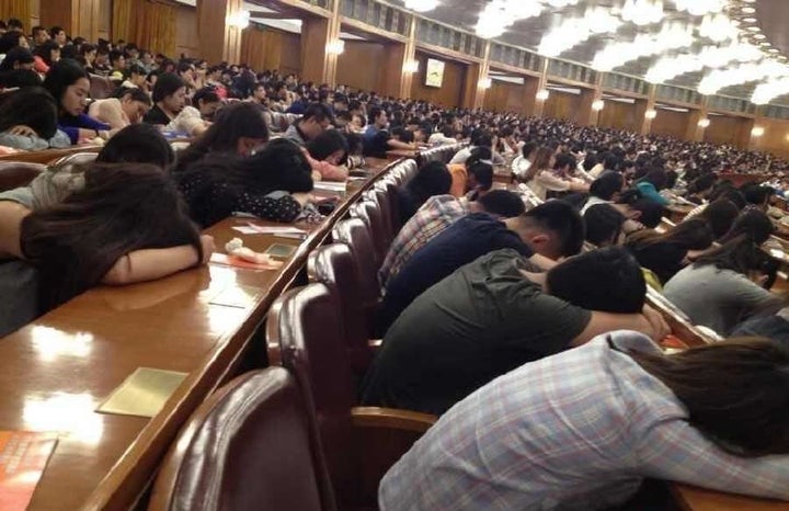 Students falling asleep during a lecture in Beijing.