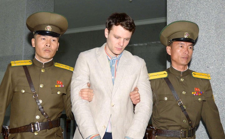 This photo released by Kyodo on March 16, 2016, shows Otto Frederick Warmbier, a University of Virginia student who was detained in North Korea, taken to the country's top court in Pyongyang.