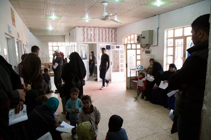 Patients wait to see a doctor at the primary health care clinic in Gogjali, a neighborhood in eastern Mosul. The area has been under control of the Iraqi army since late 2016.