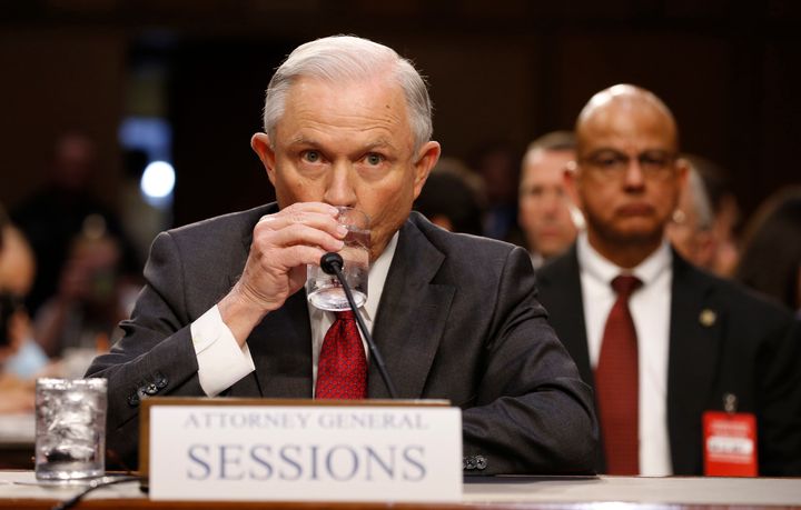 Attorney General Jeff Sessions takes a sip of water as he prepares to testify to a Senate committee Tuesday.