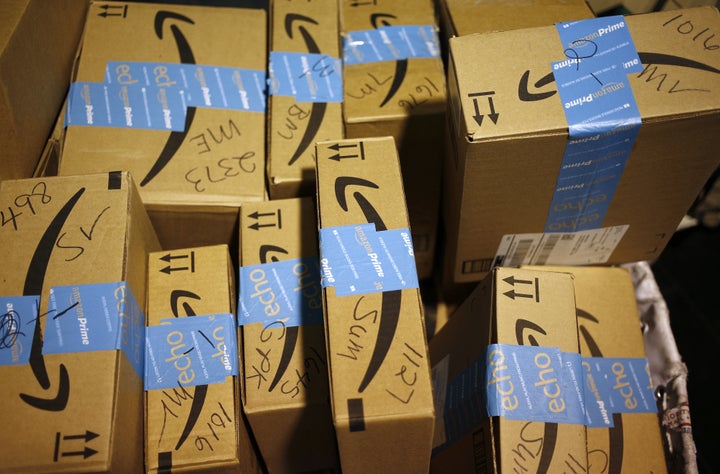 Amazon.com Inc. packages inside a post office in Shelbyville, Kentucky. The online giant is attempting to take a bite out of other retailers' low-income consumer base.