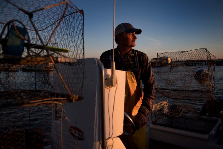 Mayor and waterman James Eskridge sets out to check his crab traps during the early morning in Tangier, Virginia, May 16, 2017, where climate change and rising sea levels threaten the inhabitants of the slowly sinking island.