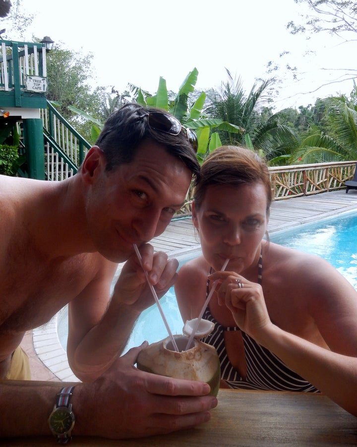 Enjoying fresh coconut juice poolside at the Jungle Dome after our ATM excursion.