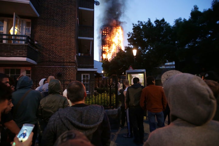 Residents watch as the 27-storey Grenfell Tower burn where a 'number of fatalities' have occurred