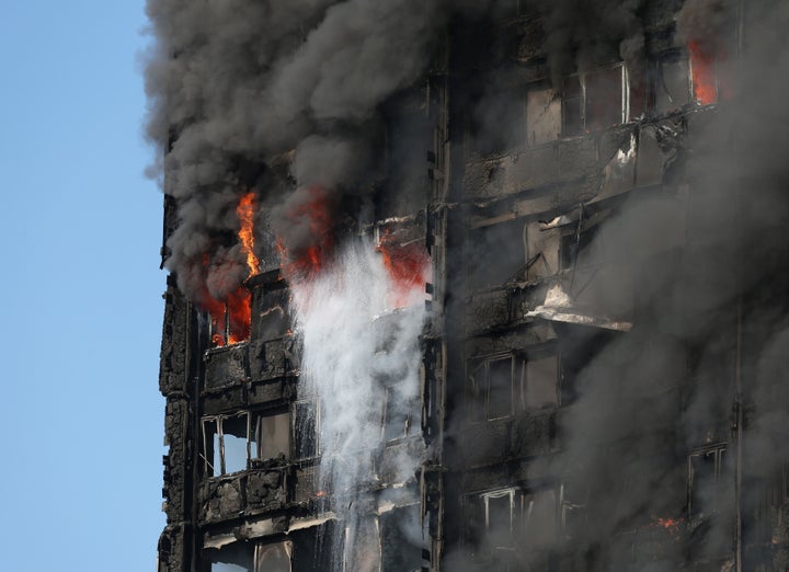 Smoke billows from the fire that engulfed the 24-storey Grenfell Tower in west London 