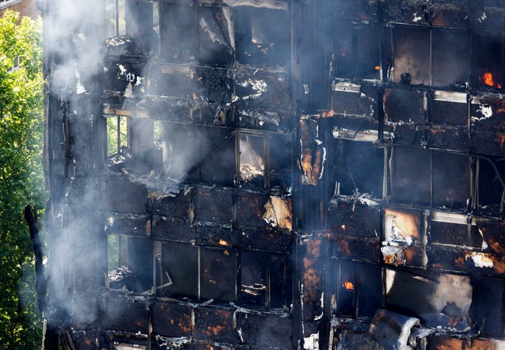 Smoke billows from a fire that has engulfed the 24-storey Grenfell Tower in west London