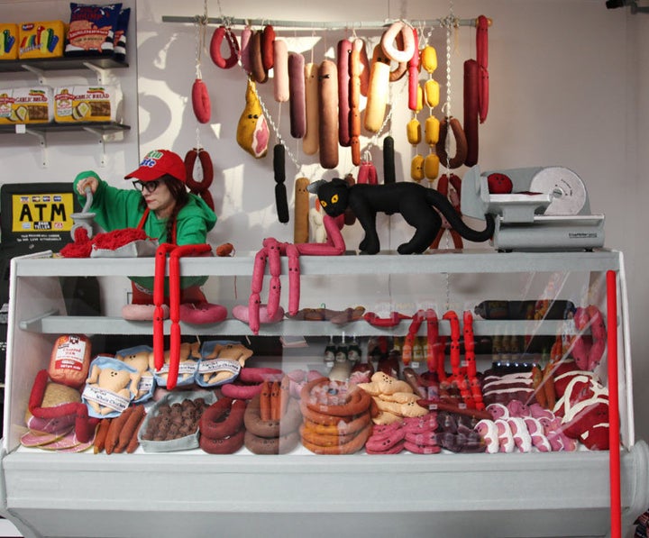 <p>Artist Lucy Sparrow grinding some meat in the middle of her <em>8 ‘Till Late</em> show. (photo © Jaime Rojo)</p>