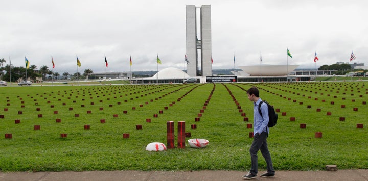 Bricks, laid out in front of Congress, represent the staggering number of Brazilians killed each week. 